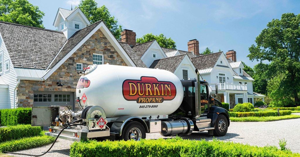 Propane delivery truck fueling a customer